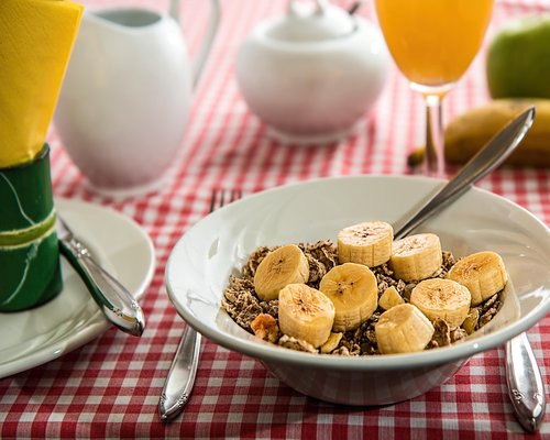 A well-organized table setting with simple healthy food and a glass of water